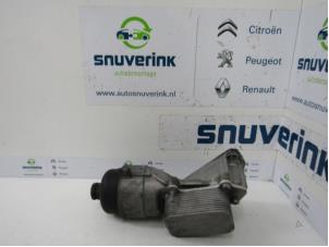 Used Oil filter housing Peugeot 208 I (CA/CC/CK/CL) 1.4 HDi Price on request offered by Snuverink Autodemontage