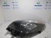 Headlight, left from a Renault Scénic III (JZ) 1.4 16V TCe 130 2010