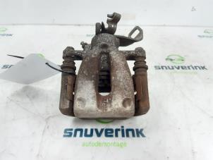 Used Rear brake calliper, left Mini Mini (R56) 1.6 16V One Price on request offered by Snuverink Autodemontage