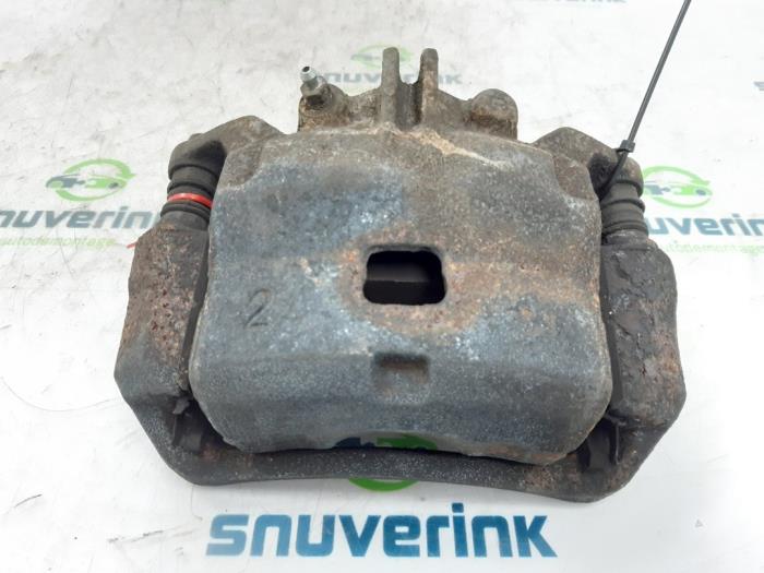 Front brake calliper, right from a Nissan NV 200 (M20M) 1.5 dCi 86 2014