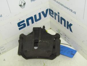 Used Front brake calliper, left Peugeot 206+ (2L/M) 1.4 XS Price on request offered by Snuverink Autodemontage