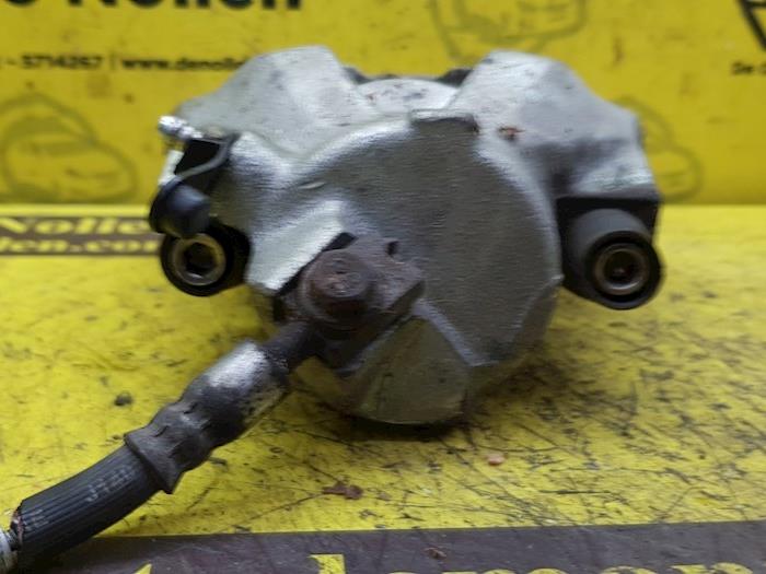 Front brake calliper, left from a Volkswagen Golf IV (1J1) 1.8 20V Turbo 1999