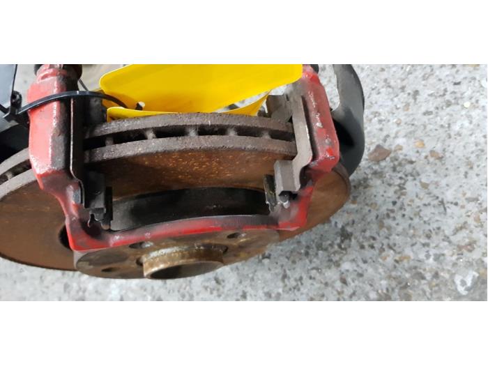 Rear brake calliper, left from a Volkswagen Transporter T5 2.0 BiTDI DRF 2015