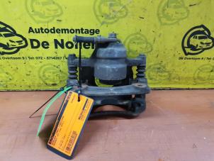 Used Front brake calliper, left Peugeot 107 1.0 12V Price € 40,00 Margin scheme offered by de Nollen autorecycling