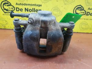 Used Front brake calliper, right Mini Mini (R56) 1.6 One D 16V Price € 50,00 Margin scheme offered by de Nollen autorecycling