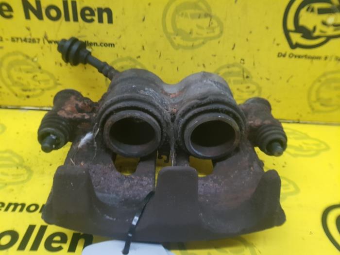 Front brake calliper, left from a Renault Master IV (FV) 2.3 dCi 100 16V FWD 2011