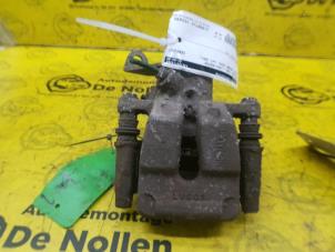 Used Rear brake calliper, left Renault Scénic I (JA) 1.4 16V Price € 25,00 Margin scheme offered by de Nollen autorecycling