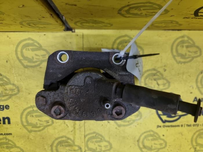 Front brake calliper, left from a Renault Twingo II (CN) 1.2 16V 2011