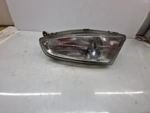 Used Headlight, left Mitsubishi Colt (CJ) 1.3 GL,GLX 12V Price € 35,00 Margin scheme offered by de Nollen autorecycling