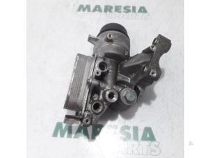 Używane Uchwyt filtra oleju Alfa Romeo MiTo (955) 1.4 Multi Air 16V Cena € 65,00 Procedura marży oferowane przez Maresia Parts