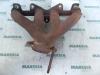 Exhaust manifold from a Renault Twingo (C06), 1993 / 2007 1.2, Hatchback, 2-dr, Petrol, 1.149cc, 43kW (58pk), FWD, D7F700; D7F701; D7F702; D7F703; D7F704, 1996-05 / 2007-06, C066; C068; C06G; C06S; C06T 2000