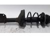 Fronts shock absorber, left from a Renault Twingo II (CN) 1.2 16V 2010