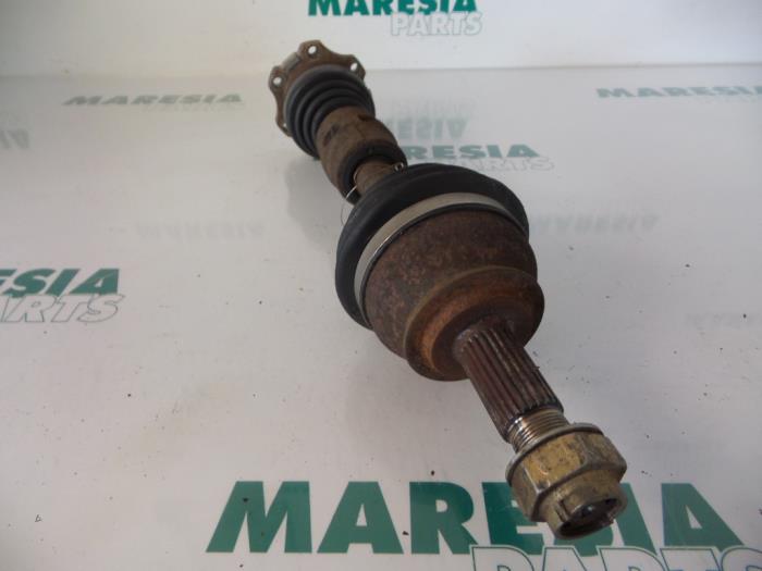 Front drive shaft, left from a Fiat Punto II (188) 1.9 JTD 80 ELX 2001