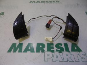 Used Steering wheel mounted radio control Fiat Grande Punto (199) 1.4 Price € 35,00 Margin scheme offered by Maresia Parts