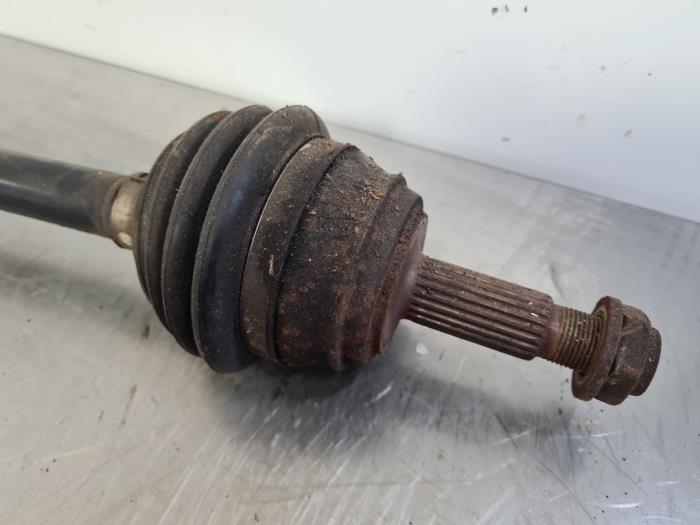 Front drive shaft, left from a Seat Ibiza II (6K1) 1.4 16V 2002
