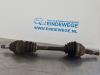 Front drive shaft, left from a Opel Astra H GTC (L08) 1.4 16V Twinport 2008