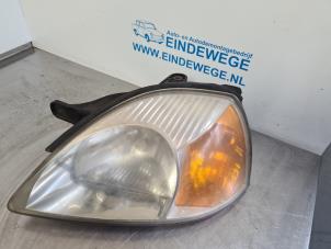 Used Headlight, left Kia Rio (DC12) 1.5 16V Price € 30,00 Margin scheme offered by Auto- en demontagebedrijf Eindewege