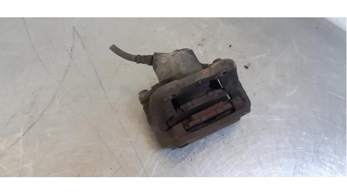 Front brake calliper, left from a Renault Twingo (C06) 1.2 1999