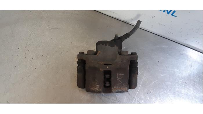 Front brake calliper, left from a Renault Twingo (C06) 1.2 1999