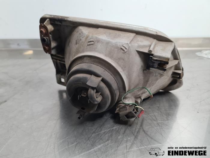 Headlight, left from a Toyota Starlet (EP8/NP8) 1.3 12V