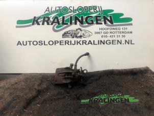 Używane Zacisk hamulcowy lewy tyl Ford Focus 1 Wagon 1.8 16V Cena € 35,00 Procedura marży oferowane przez Autosloperij Kralingen B.V.