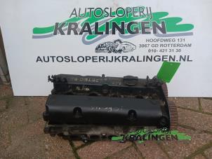 Używane Glowica cylindra Ford Focus 1 1.4 16V Cena € 100,00 Procedura marży oferowane przez Autosloperij Kralingen B.V.