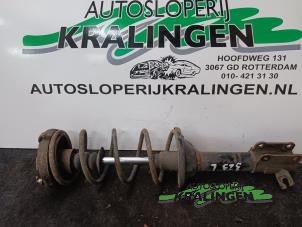 Used Rear shock absorber, left Mazda 323 F (BG14) 1.8i 16V Price on request offered by Autosloperij Kralingen B.V.