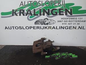 Used Rear brake calliper, left Nissan Primera Wagon (W12) 1.8 16V Price € 50,00 Margin scheme offered by Autosloperij Kralingen B.V.