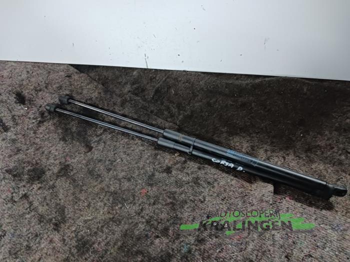 Set of tailgate gas struts from a Opel Corsa D 1.2 16V 2006