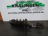 Fronts shock absorber, left from a Opel Corsa D 1.2 16V 2006