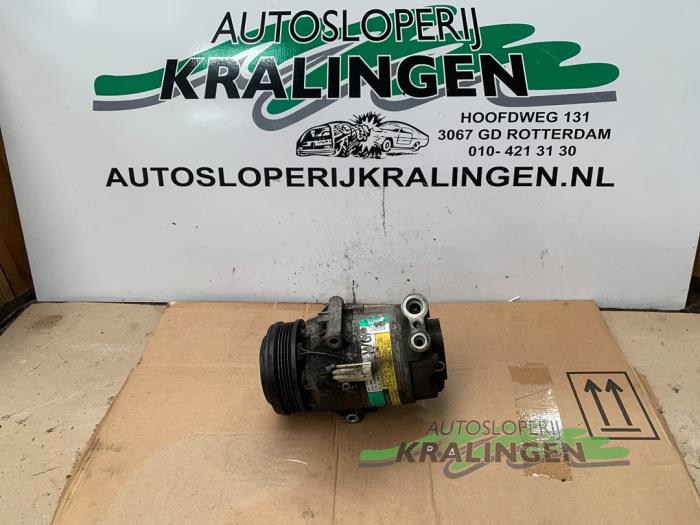 Air conditioning pump from a Opel Astra H (L48) 1.4 16V Twinport 2004