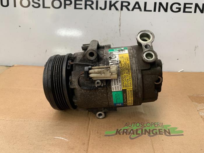 Air conditioning pump from a Opel Astra H (L48) 1.4 16V Twinport 2004