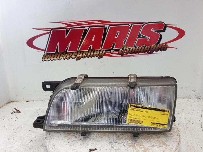 Usados Faro izquierda Nissan Sunny (N14) 1.4 16V Precio € 25,00 Norma de margen ofrecido por Autosloopbedrijf gebr. Maris