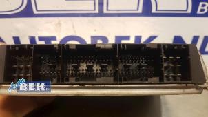 Engine management computer from a Volkswagen Passat Variant (3B5) 2.5 TDI V6 24V 1999