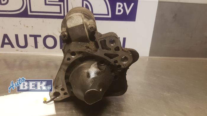 Starter from a Renault Clio III (BR/CR) 1.4 16V 2006