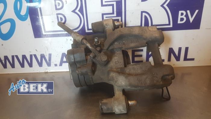 Rear brake calliper, left from a Audi Q3 (F3B) 2.0 35 TDI 16V 2019