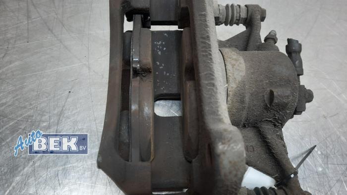 Front brake calliper, left from a Volkswagen Passat Variant (3G5) 1.4 TSI 16V 2015