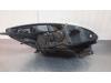 Headlight, left from a Renault Scénic III (JZ) 1.5 dCi 110 2015