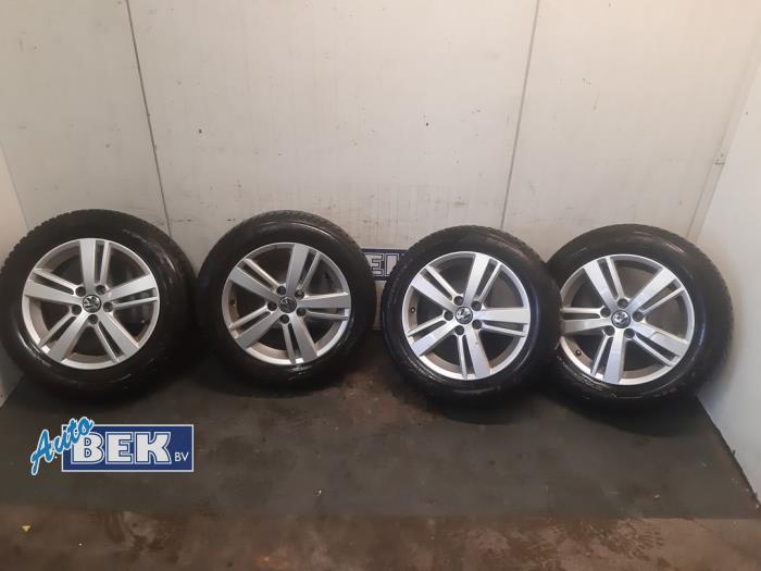 Set of sports wheels + winter tyres from a Volkswagen Golf IV (1J1) 1.4 16V 2003