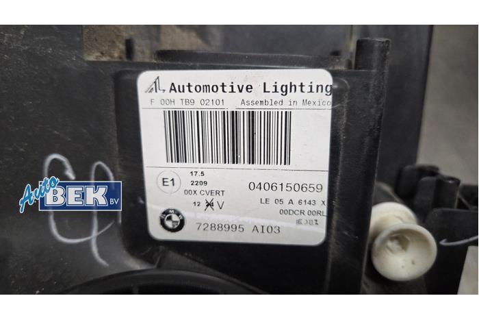 Headlight, left from a BMW X5 (E70) 3.0sd 24V 2008
