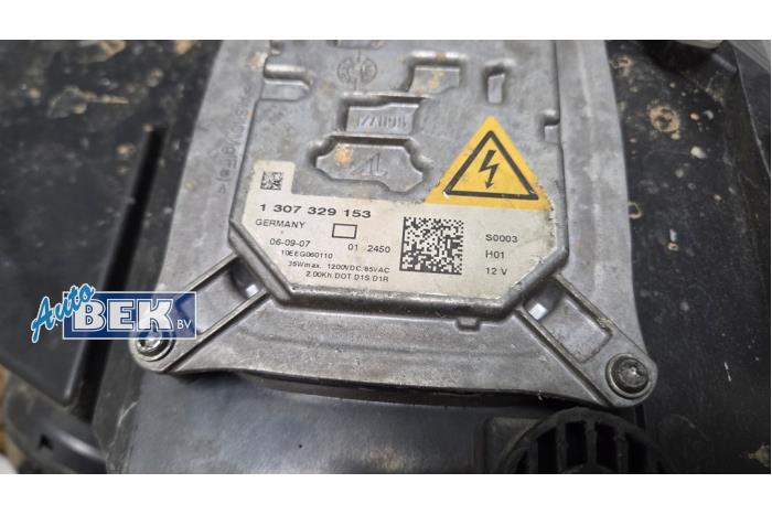 Headlight, left from a BMW X5 (E70) 3.0sd 24V 2008