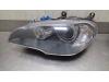 Headlight, left from a BMW X5 (E70) 3.0sd 24V 2008