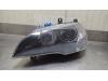 Headlight, left from a BMW X5 (E70) 3.0sd 24V 2008