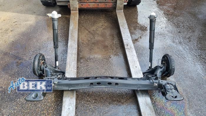 Rear axle beam with reducer