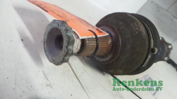 Front drive shaft, left from a Seat Ibiza IV SC (6J1) 1.4 TDI 2009