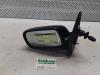 Wing mirror, left from a Toyota Yaris (P1), 1999 / 2005 1.0 16V VVT-i, Hatchback, Petrol, 998cc, 50kW (68pk), FWD, 1SZFE, 1999-04 / 2005-09, SCP10 2000