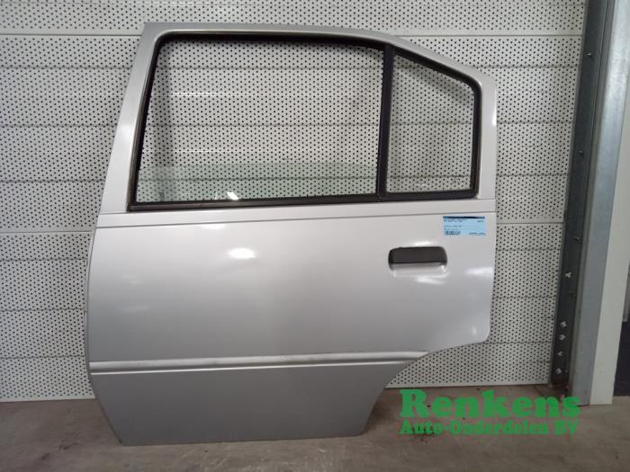 Rear door 4-door, left from a Opel Kadett E (33/34/43/44) 1.2 S,LS 1986