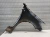 Front wing, left from a Renault Clio III (BR/CR) 1.5 dCi FAP 2012