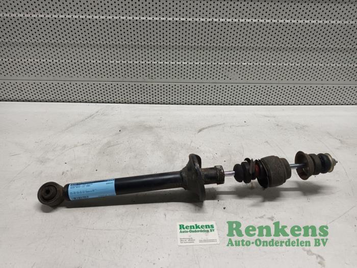 Rear shock absorber, left from a Mazda Demio (DW) 1.3 16V 1999