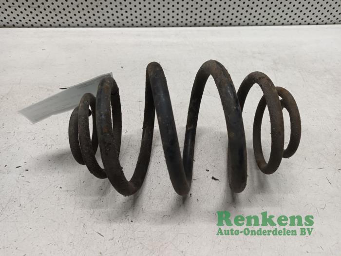 Rear coil spring from a Opel Kadett E (33/34/43/44) 1.2 S,LS 1986